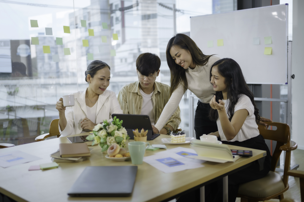 Malaysian tech team collaborating in hybrid office setting