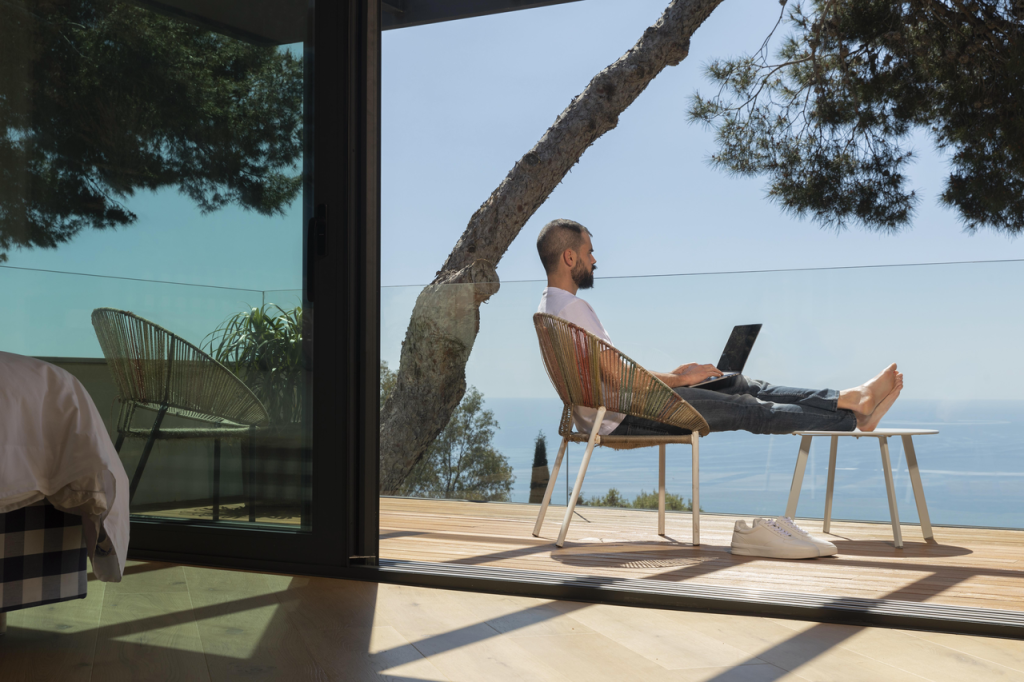 Employee working comfortably in a hybrid office with balanced lifestyle